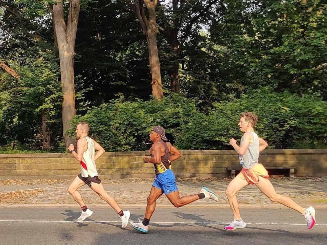Three runners in mid-race down 5th Avenue in New York City