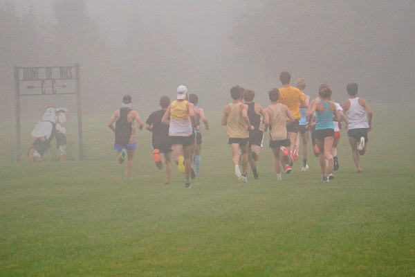 Cross country runners heading into foggy field at Noblesville's Chinquapin Ridge XC Course